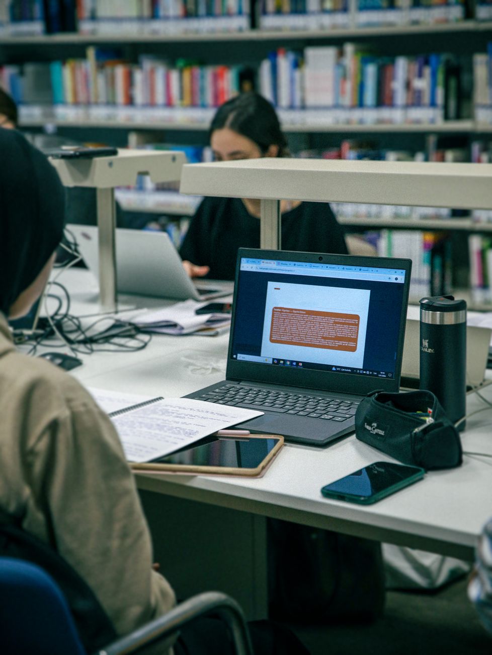 students studying in modern library setting