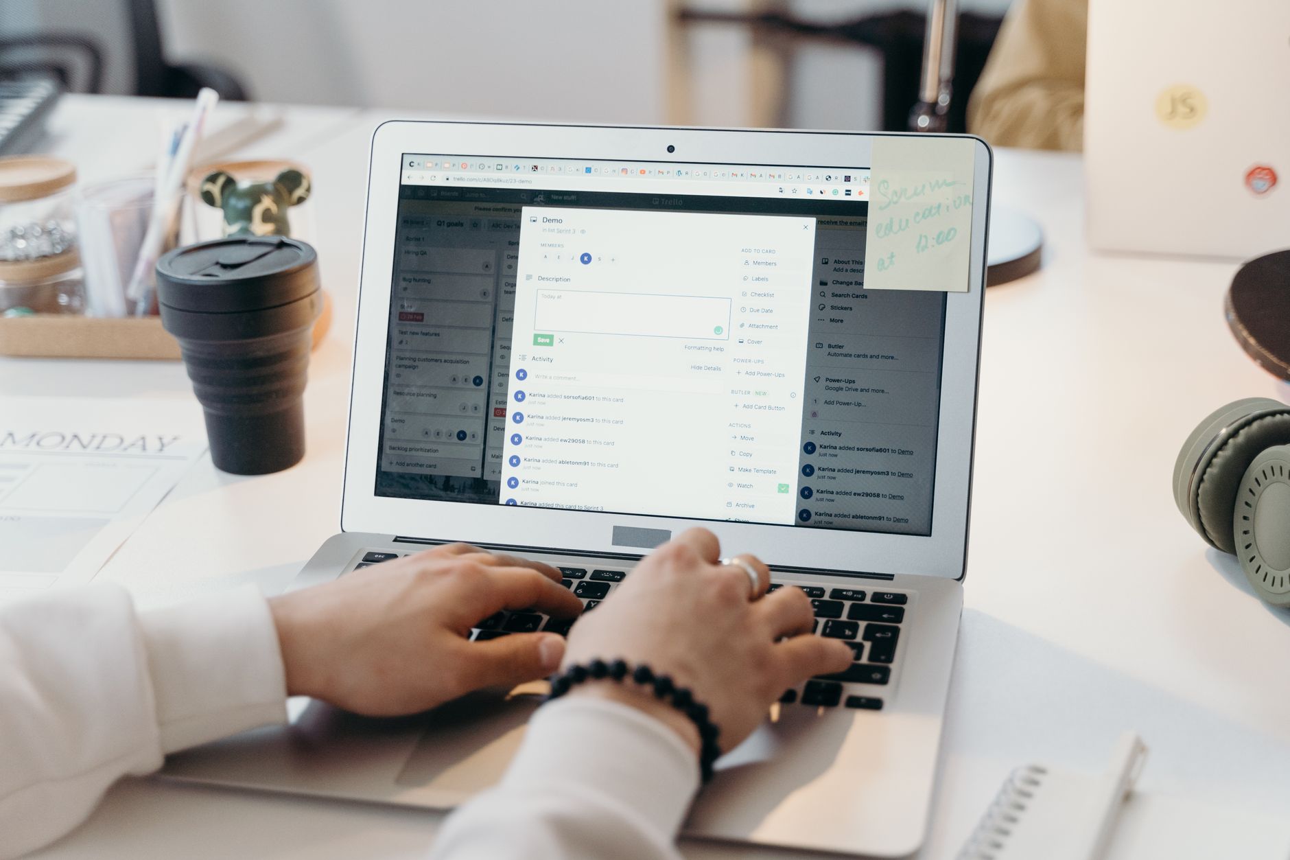 Person writing an email on a laptop at a desk using AI tools