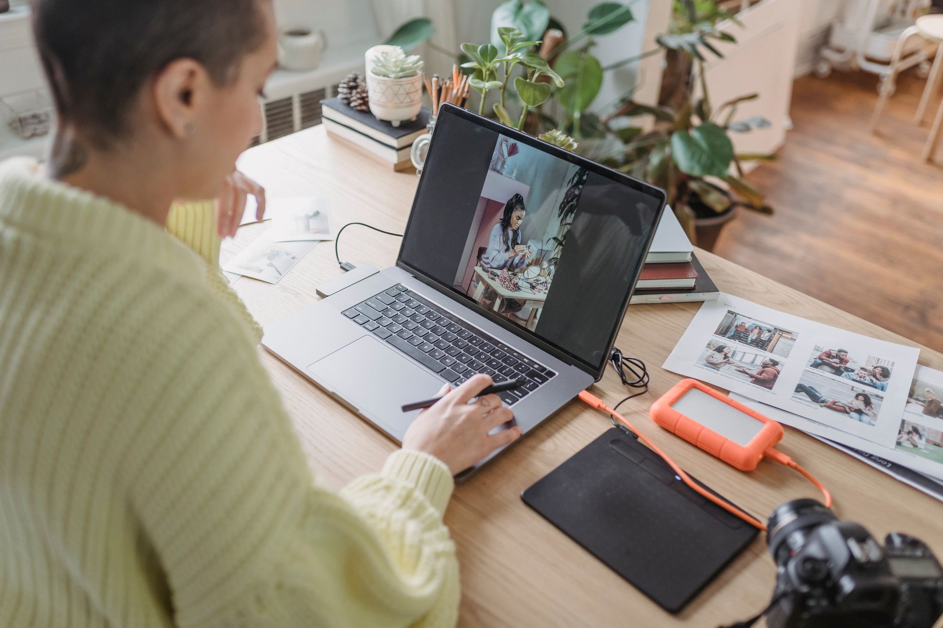 Person editing a photo on a laptop, representing Google's new AI image editor Pics